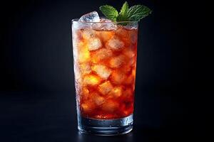 Refreshing Iced Tea with Mint Garnish Against Black Background photo