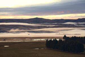 view of the foggy mountains at the farm photo