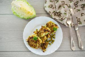 simple breakfast.vegetable cutlets from early cabbage with peas photo