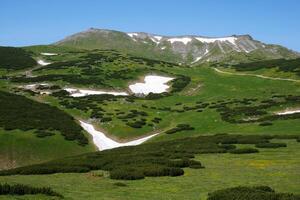 A view of Puchberg am Schneeberg, Austrian Alps. Alpine scenery with snow in summer photo