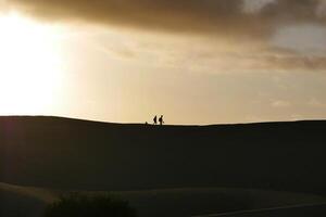 A colorful sunset in a Maspalomas dune, Gran Canaria island photo