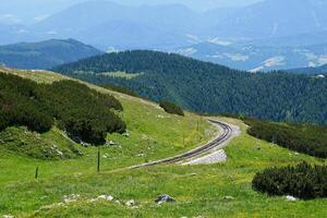 A view of Puchberg am Schneeberg, Austrian Alps. Alpine scenery with a railway rails photo