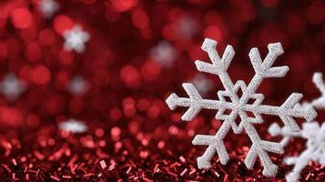 Delicate snowflake drifting against shimmering surface, red highlighting winter holiday sparkle photo