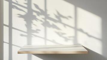 Empty wooden tabletop shelf with window shadow overlay on background wall white for product placement photo