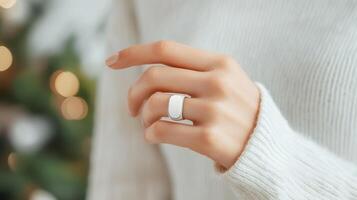 a wearing Woman smart ring, a wearable technology device, showcasing its sleek design and potential for connectivity photo