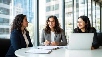 Diverse group of young professionals is working diversity on laptops in a modern office, engaged in together collaborative project, demonstrating teamwork and a in the workplace photo
