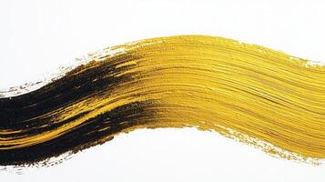 Gold paint smearing across textured creating elegant artistic backdrop with metallic shimmer photo