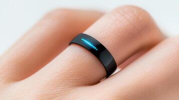 Close up of a hand sleek, a wearing black smart ring, showcasing the integration of technology into everyday accessories photo
