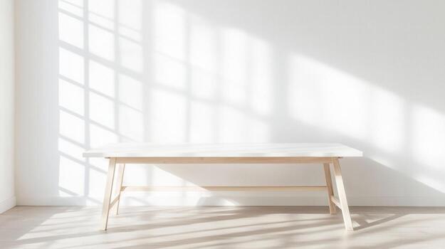 Empty white table standing in minimalist room with window light casting shadows on white wall, creating serene atmosphere photo