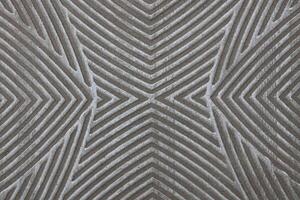 Close-up photograph of floor tiles creating an abstract symmetrical pattern. photo