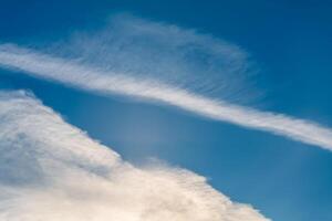 Sky with with cumulus cloud, airplane trail, natural background, celestial landscape, sky background photo