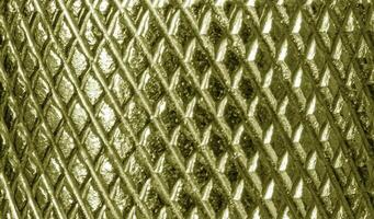 A close up of a metal mesh with a pattern photo