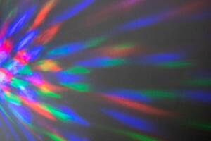 Beautiful multicolored geometric patterns on a dark background photo