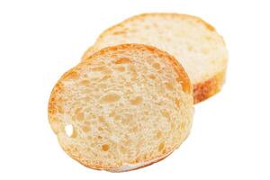 Two pieces of bread isolated. Slices of baguette isolated on white. photo