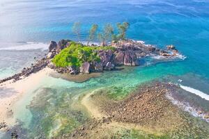Drone shot of port glaud beach, Mahe, granite stones, white sandy beach and clear turquoise water, Seychelles 1 photo