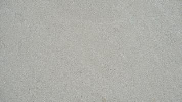 Fine sandy beach at the coast. Wet areas with curved lines. for background and textured. photo