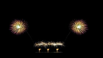 Beautiful fireworks display on black sky with copy space for greeting text. Celebration and anniversary concept photo