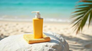 Mockup sunscreen bottle on stone with towel at tropical beach. Summer skincare and sun protection concept for vacation and travel photo