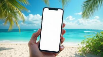 Hand holding smartphone with blank white screen on tropical beach. Mockup for mobile app, website, or digital content presentation photo