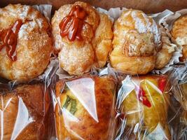 Types of cakes. Delicious cakes in bulk at the patisserie counter photo