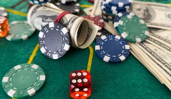 Gambling addiction. Betting for money. Clandestine says game. Illicit game. Dollar bills, property and dice. Background with copy space. photo