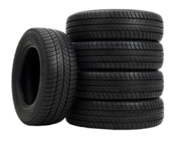 Stacked car tires and one standing tire isolated on a transparent background in a studio setting png