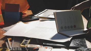 A person is working on a project on a table video