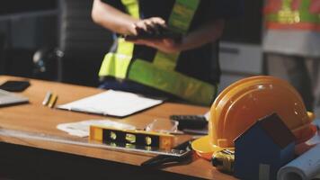 Construction workers working on a desk with tools video