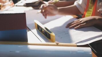 A person is working on a project with a ruler and a pencil video