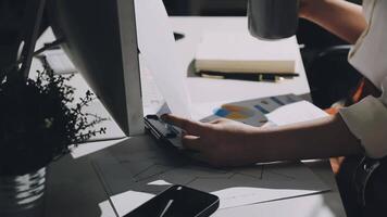 A person is working on a computer with a cup of coffee video