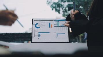 A person is looking at a screen with graphs and charts video