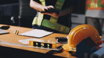 A construction worker is working on a desk video