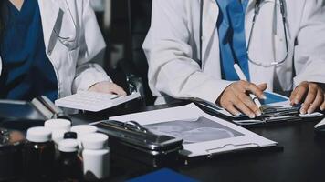 Two doctors working on a computer in a lab video
