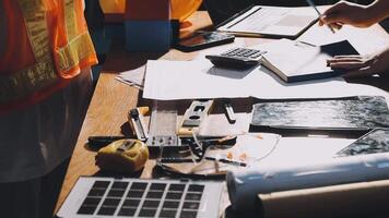 A construction worker working on a desk with tools video