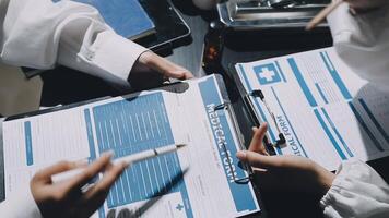 A group of doctors are working on a medical file video