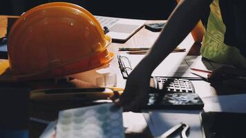 A person working on a construction project with a hard hat video