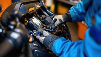 A technician using a multimeter on machinery for diagnostics photo