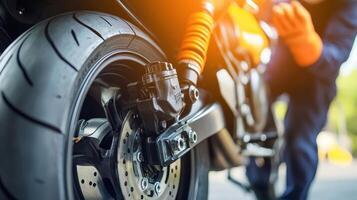 Close-up of a motorcycle wheel and brake system, highlighting maintenance and repair work photo