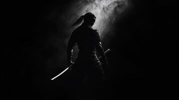 A silhouetted figure wielding a sword in a dramatic, smoky background photo