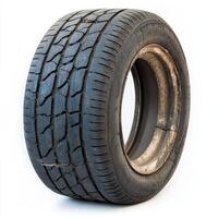 A worn-out tire with visible tread patterns, showcasing its use and wear photo