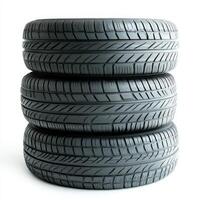 Three stacked tires showcasing tread patterns for vehicles photo