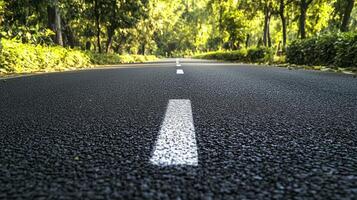 A close-up view of a road surrounded by trees, emphasizing nature and transportation photo