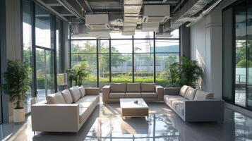 Modern lounge area with sofas and large windows, promoting relaxation and social interaction photo