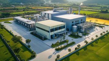Aerial view of an industrial facility surrounded by greenery and fields photo