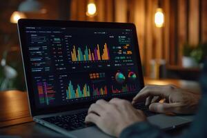 A person analyzing data on a laptop with colorful graphs and charts displayed photo