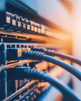 Close-up of network cables connected to a server rack, highlighting technology infrastructure photo