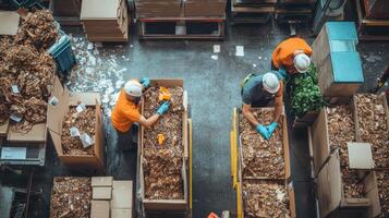 Workers sorting materials in a recycling facility, focused on waste management processes. photo