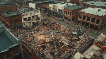 Aerial view of a demolished building site in an urban area, showcasing destruction and debris. photo