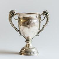 A decorative silver trophy with ornate handles, symbolizing achievement and victory. photo
