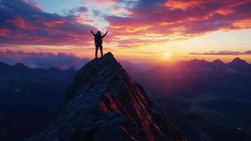A silhouette of a person triumphantly standing on a mountain peak during a vibrant sunset photo